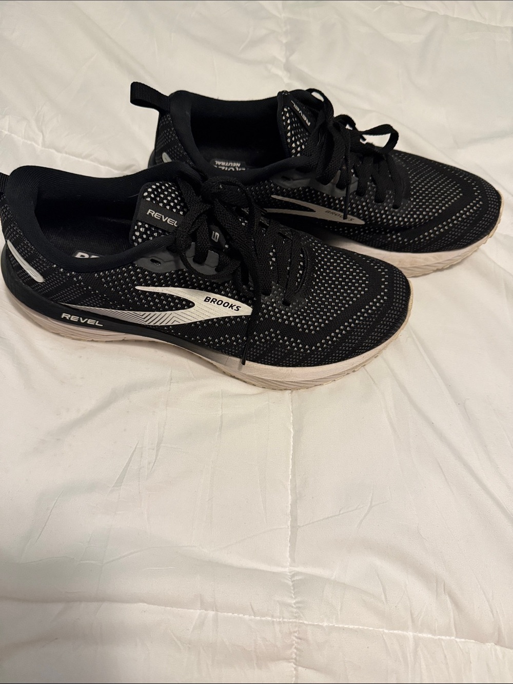 Brooks woman’s Black and White Revel Athletic Shoes